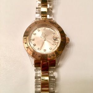 Toy Brand Watch with rhinestone and gold.